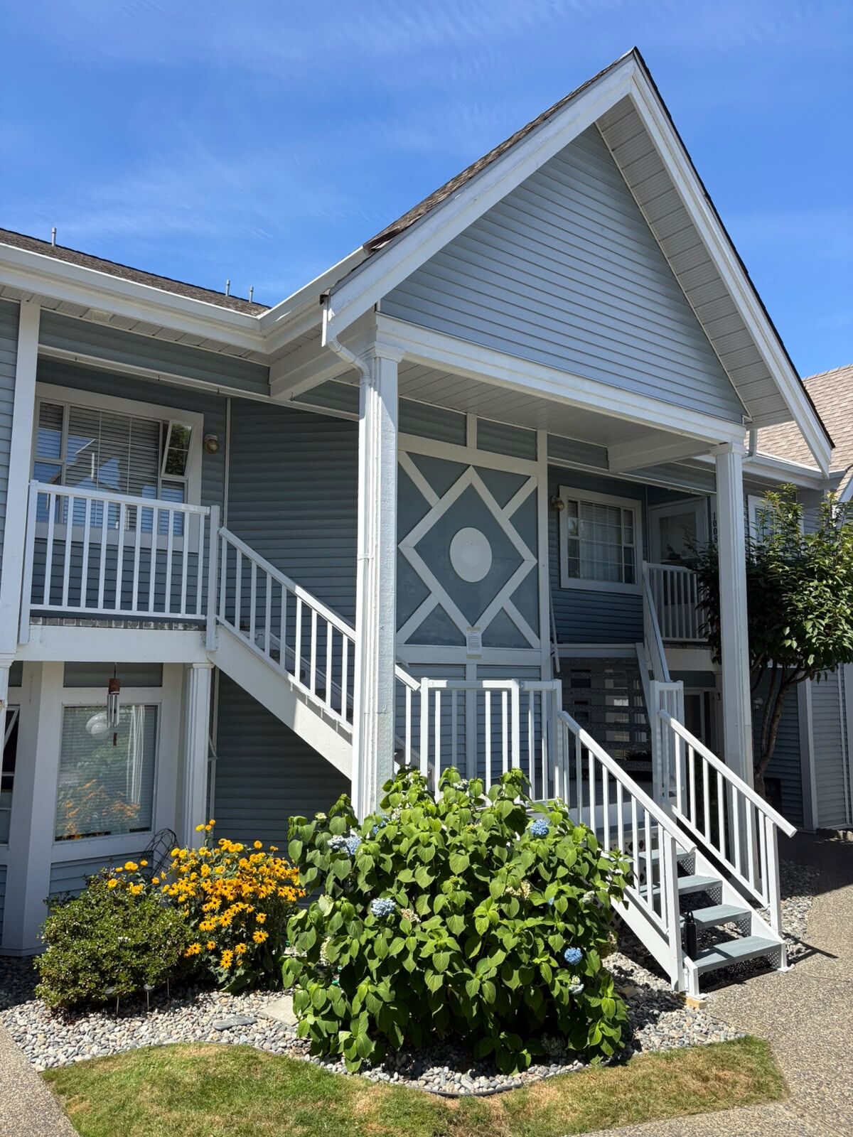 White aluminum stair and porch railings at a Surrey townhouse complex